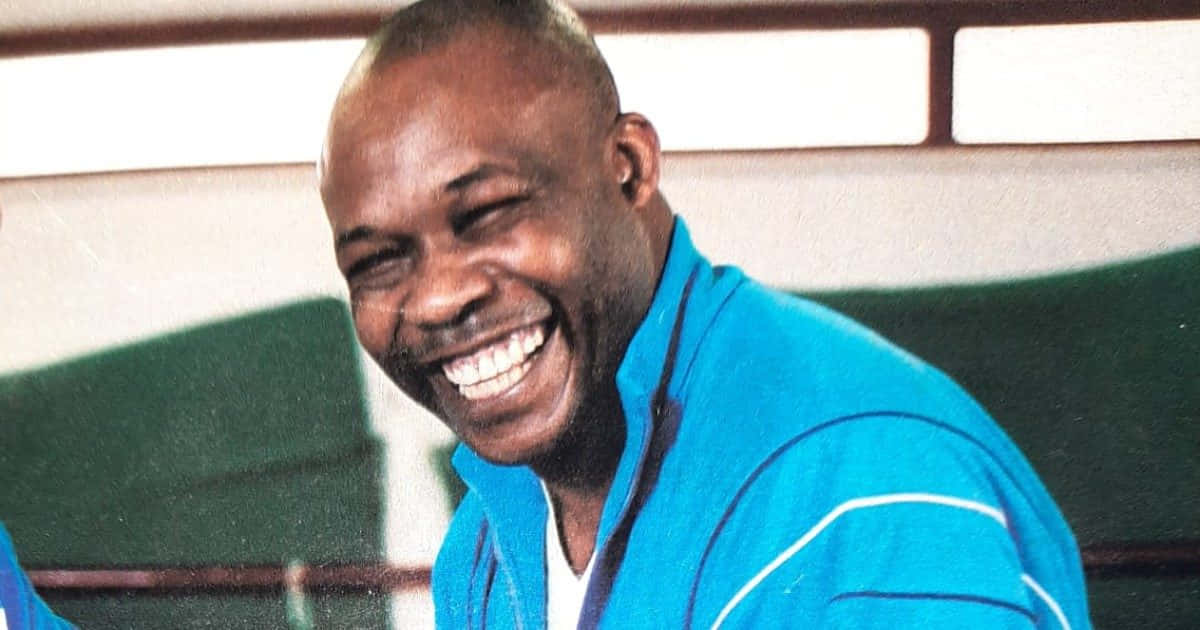 Joyful_ Man_ Laughing_in_ Blue_ Top.jpg Background