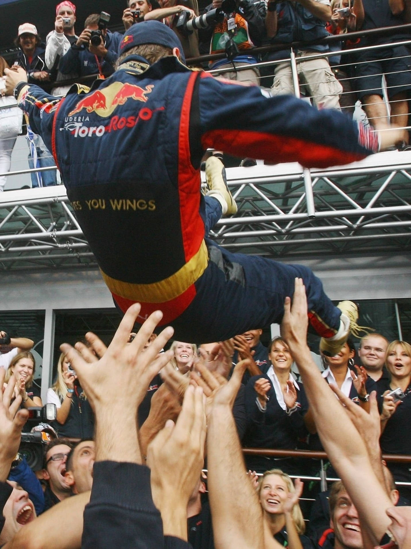 Joyful Moment: Sebastian Vettel Celebrated By His Team Background