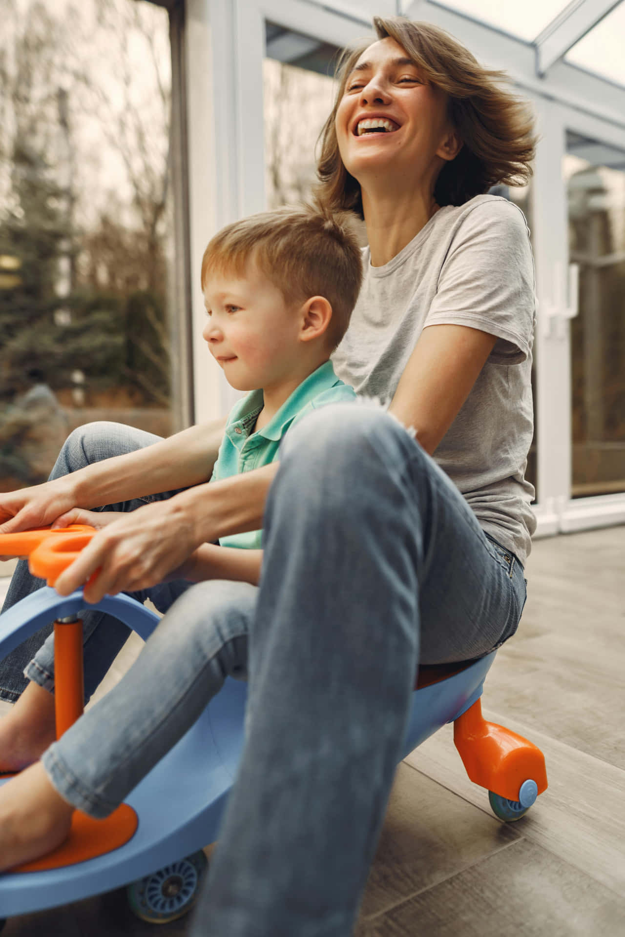 Joyful Moments With Child On Toy Car Background