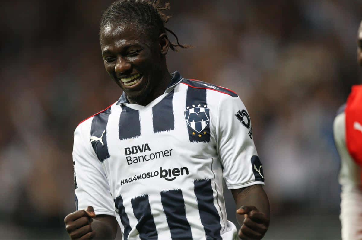 Joyful Soccer Player Celebration Background