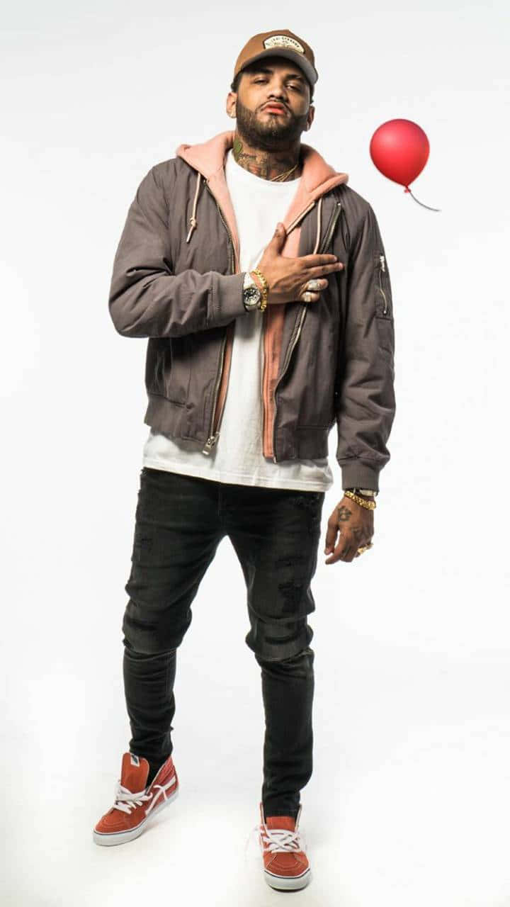 Joyner Lucas Performing At A Show Background