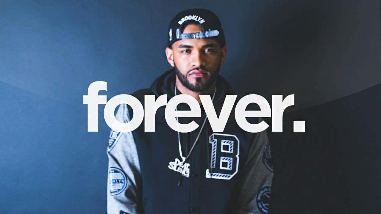 Joyner Lucas Raps On Stage Background