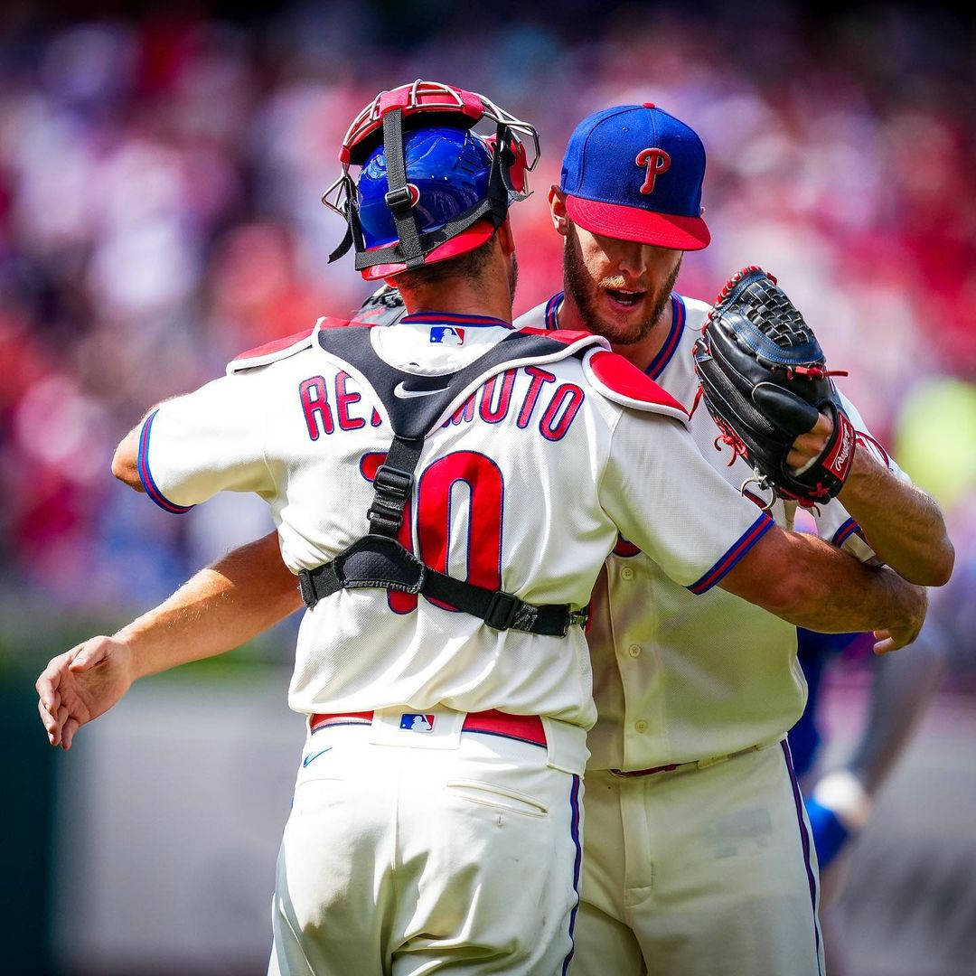 Jt Realmuto And Teammate Hug Background