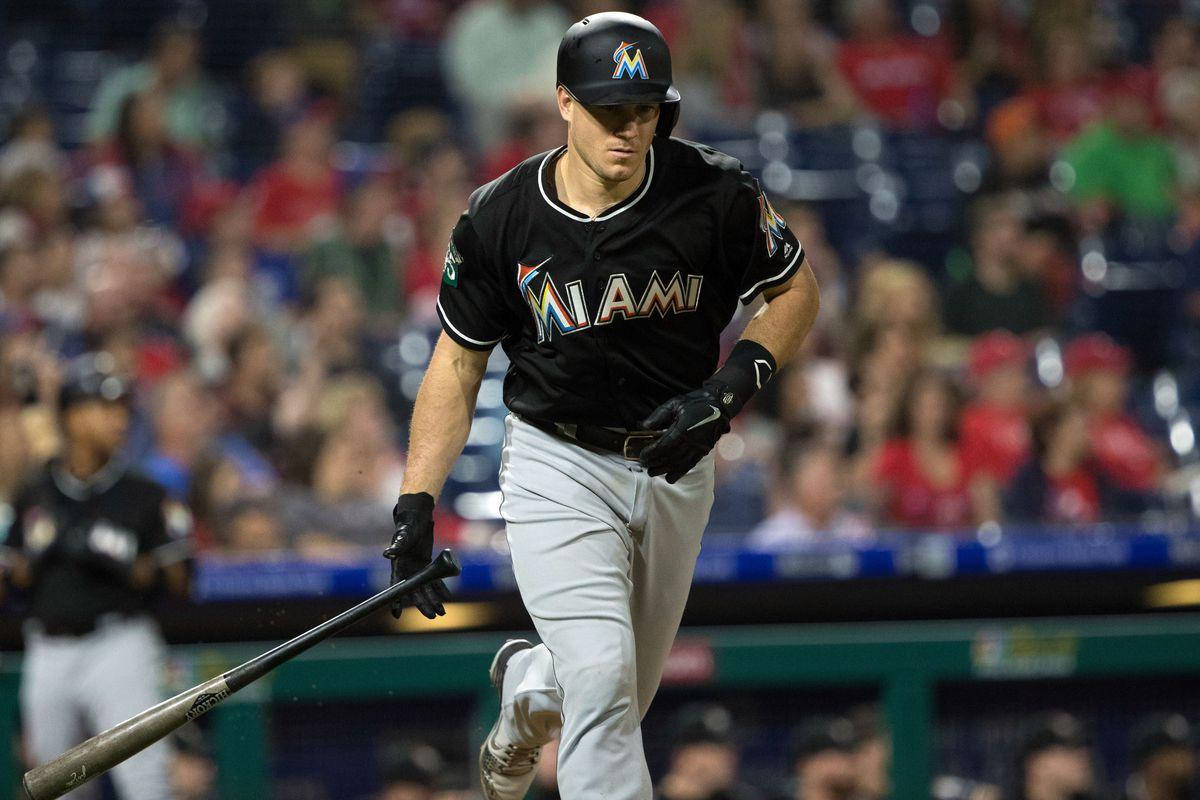 Jt Realmuto Running With Bat Background