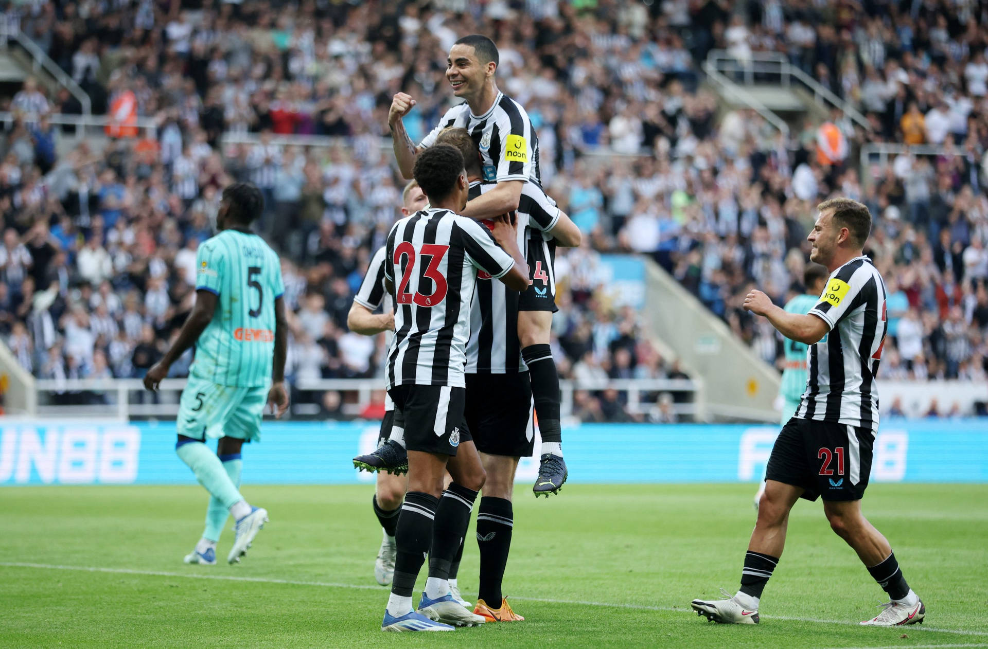 Jubilant Newcastle United Fc Players Celebrating A Victory Background