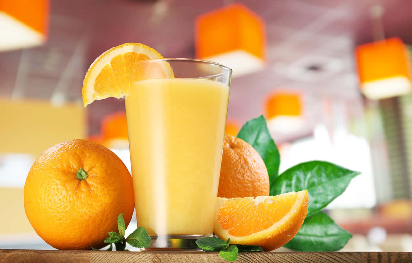 Juice With Orange Fruits And Leaves