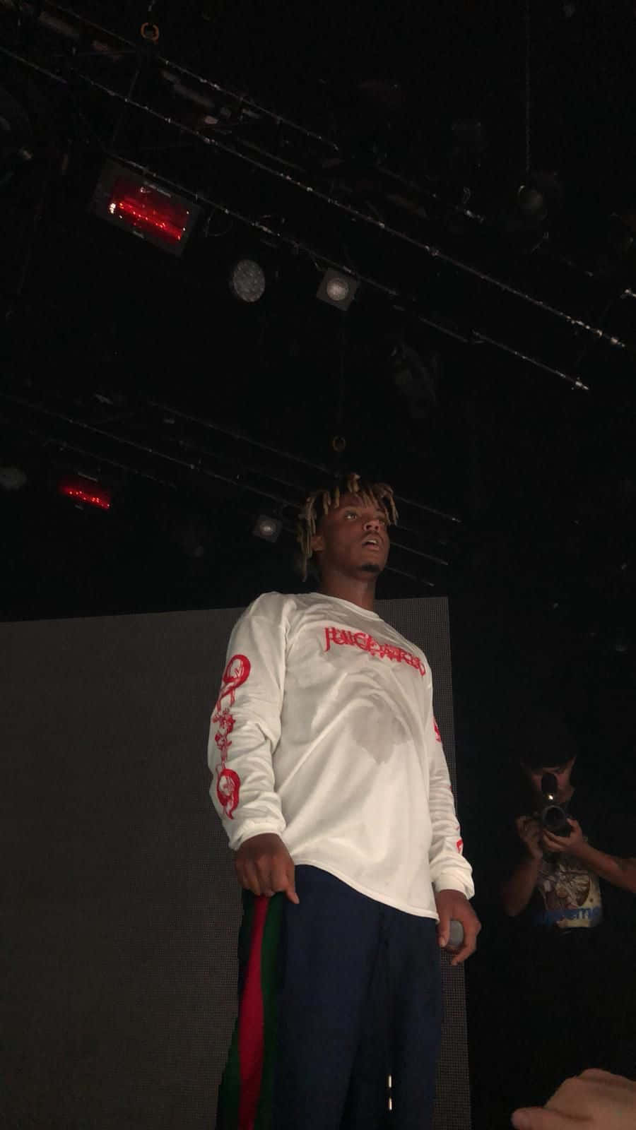 Juice Wrld Surrounded By His Iconic Music Background