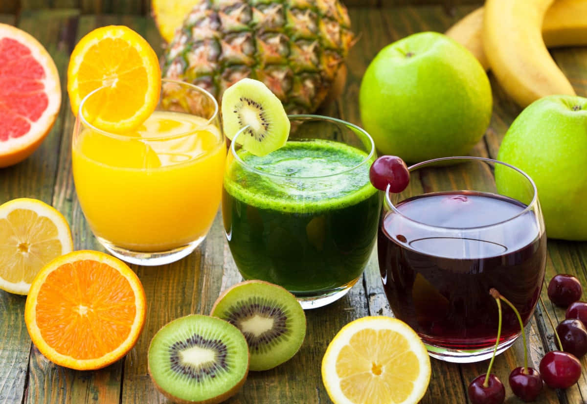 Juices With Kiwi Orange And Grape Background