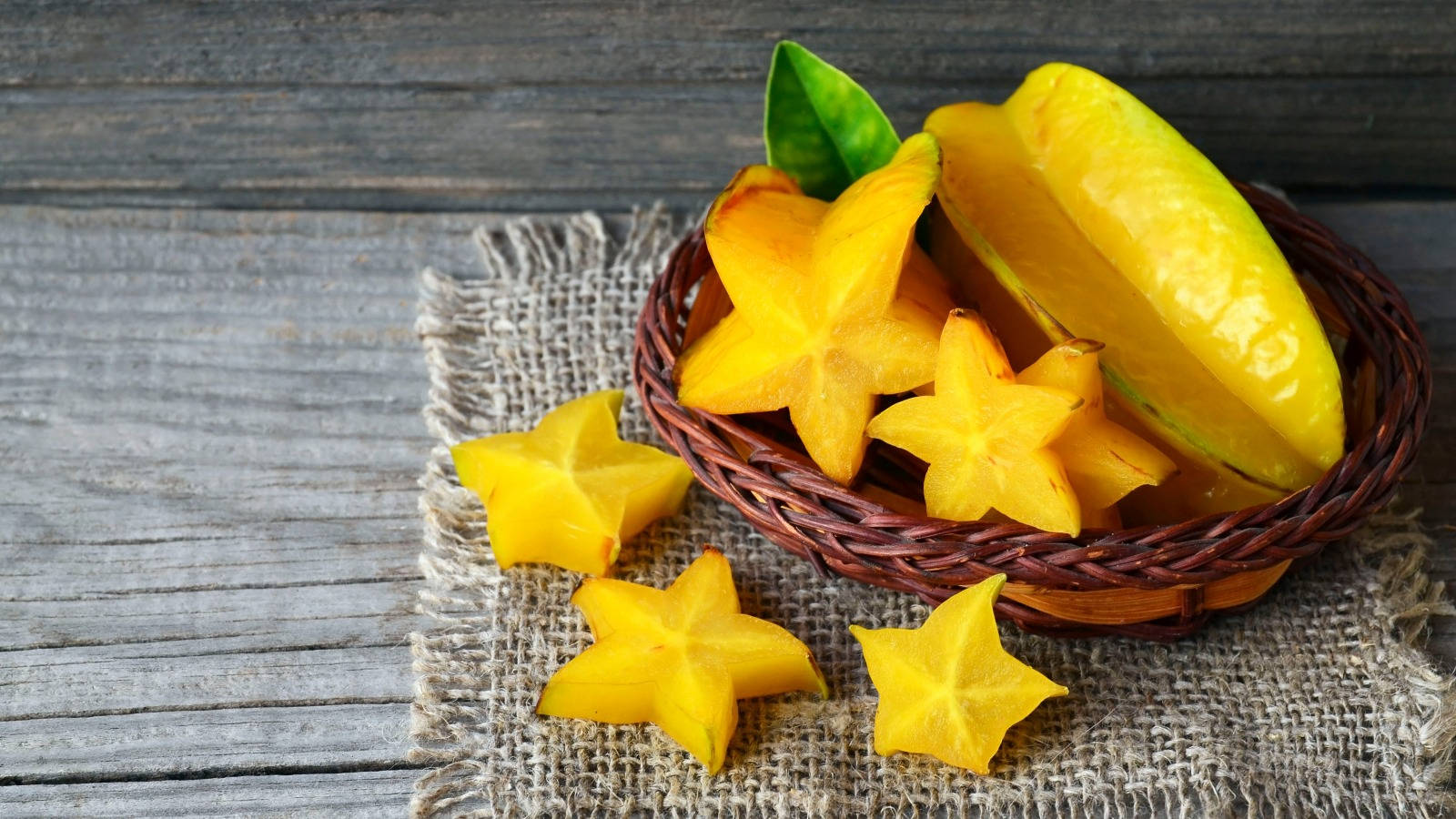 Juicy Carambola In A Rattan Basket Background