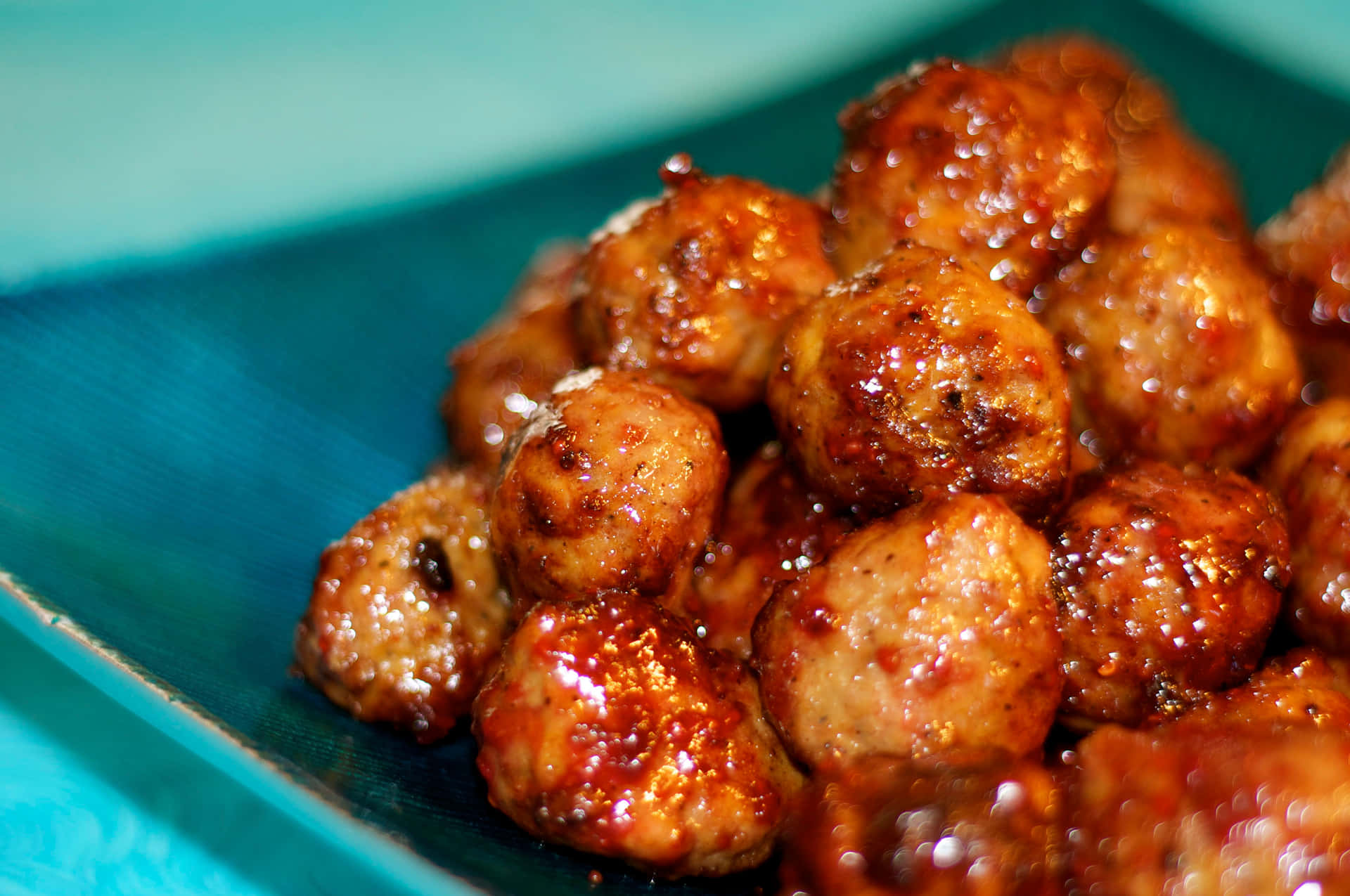 Juicy Glazed Meatballson Blue Plate.jpg Background