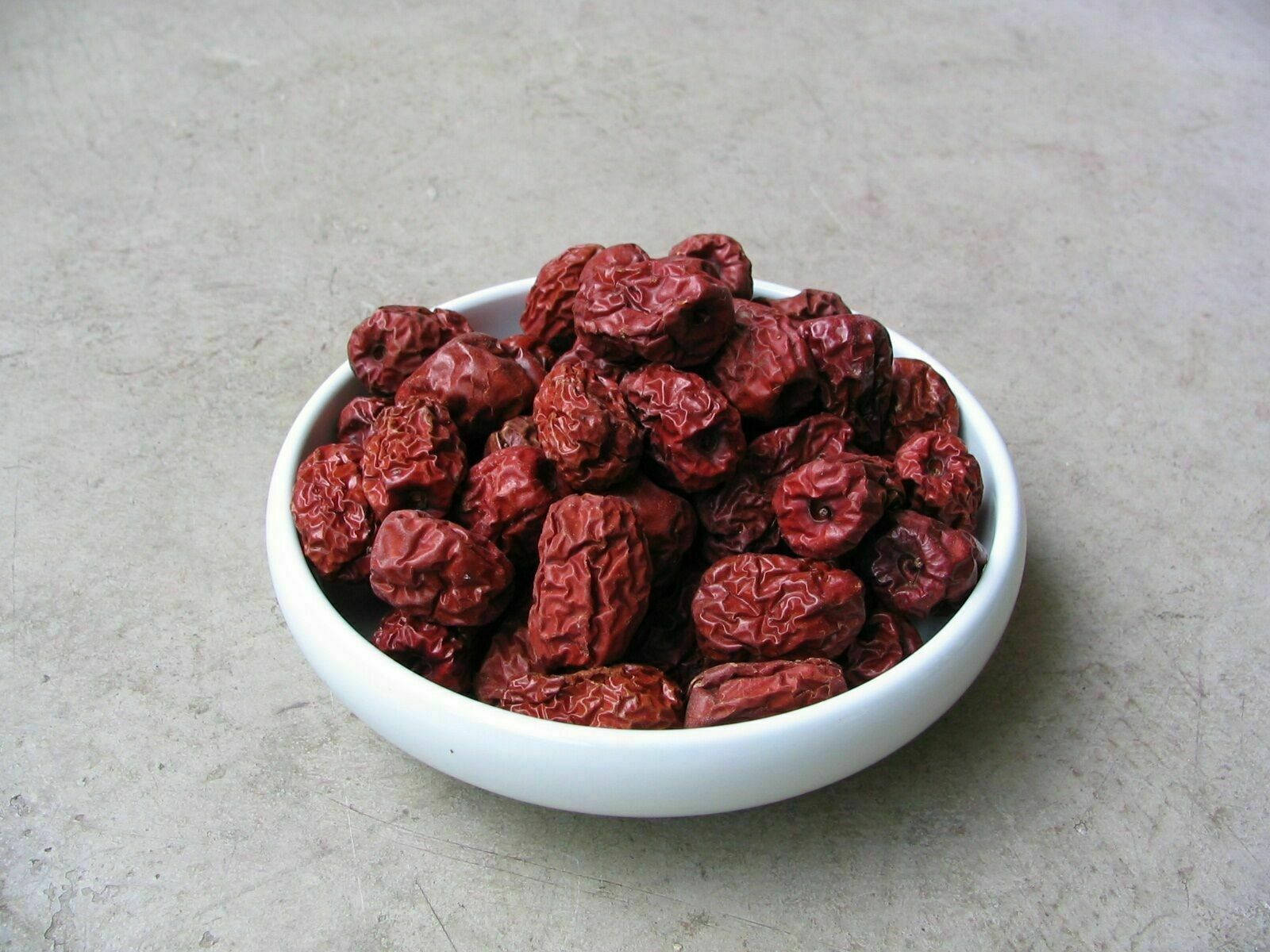 Jujube Seeds In A Saucer Background