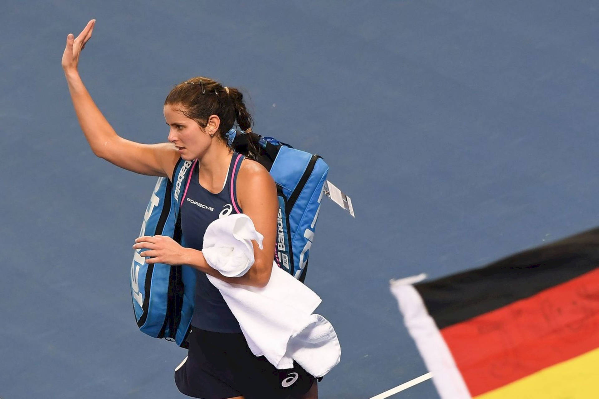 Julia Goerges Waving To The Side Background