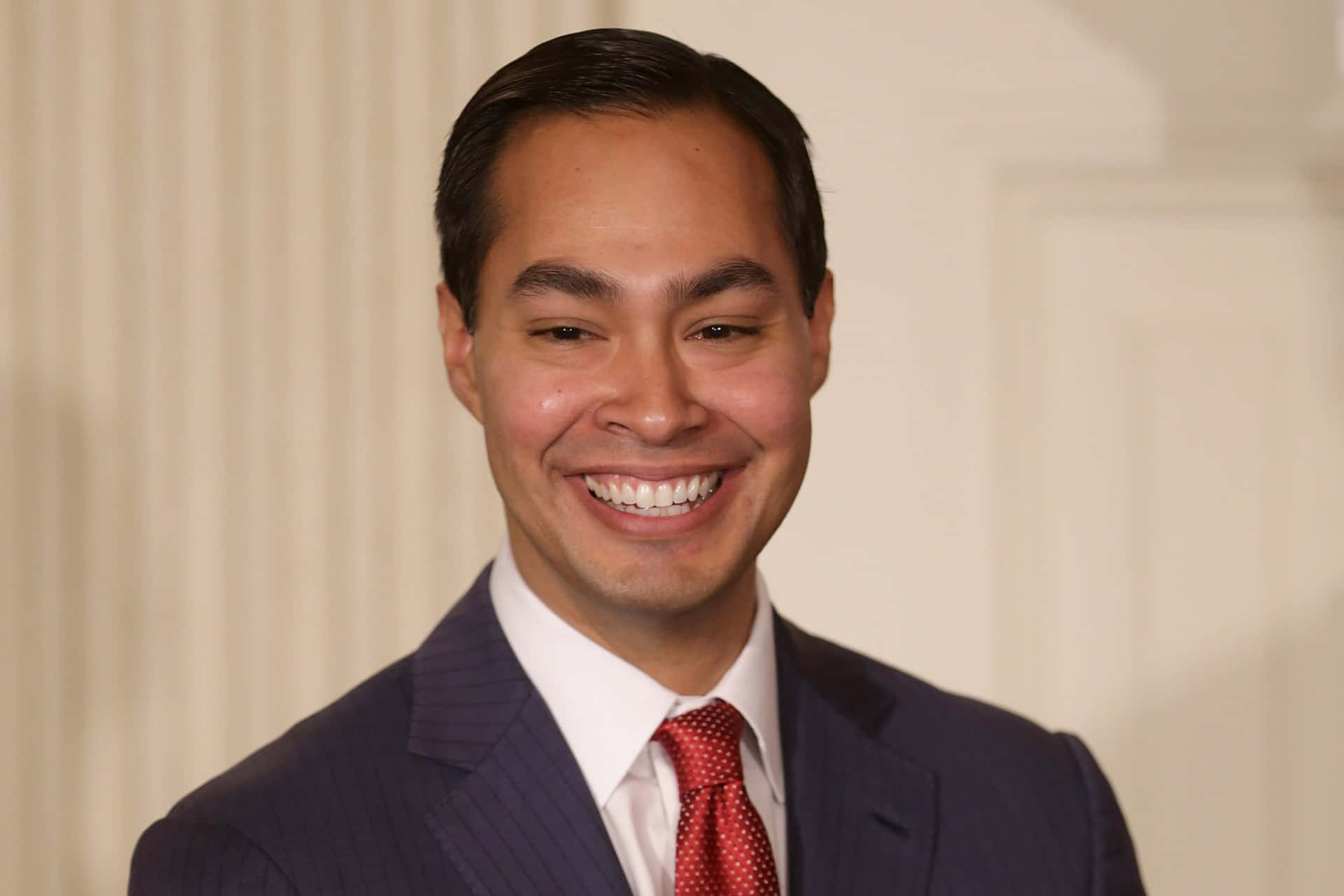 Julian Castro Flashes An Engaging Smile In A Front View Portrait. Background