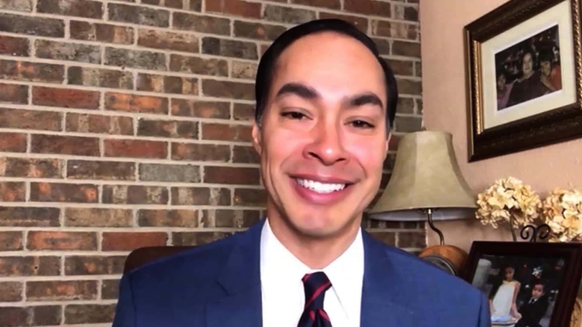 Julian Castro Smiling Brick Wall Background