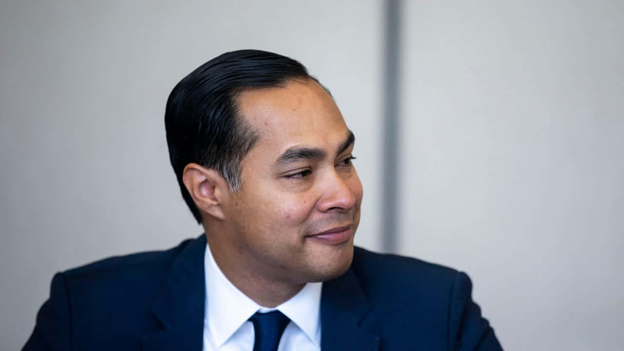Julian Castro Smiling Side View Background