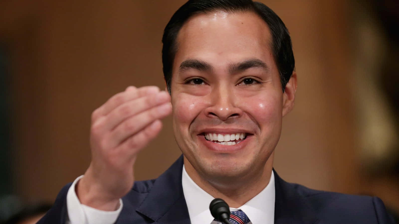 Julian Castro Smiling Up Close Background