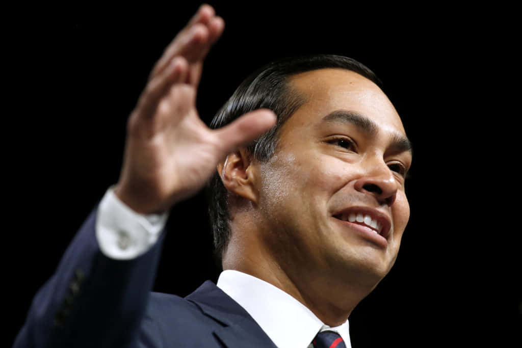 Julian Castro Waving Up Close Background