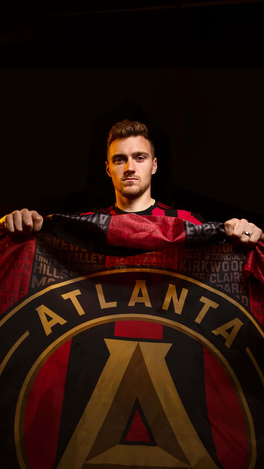 Julian Gressel Holding Atlanta United Fc Flag Background