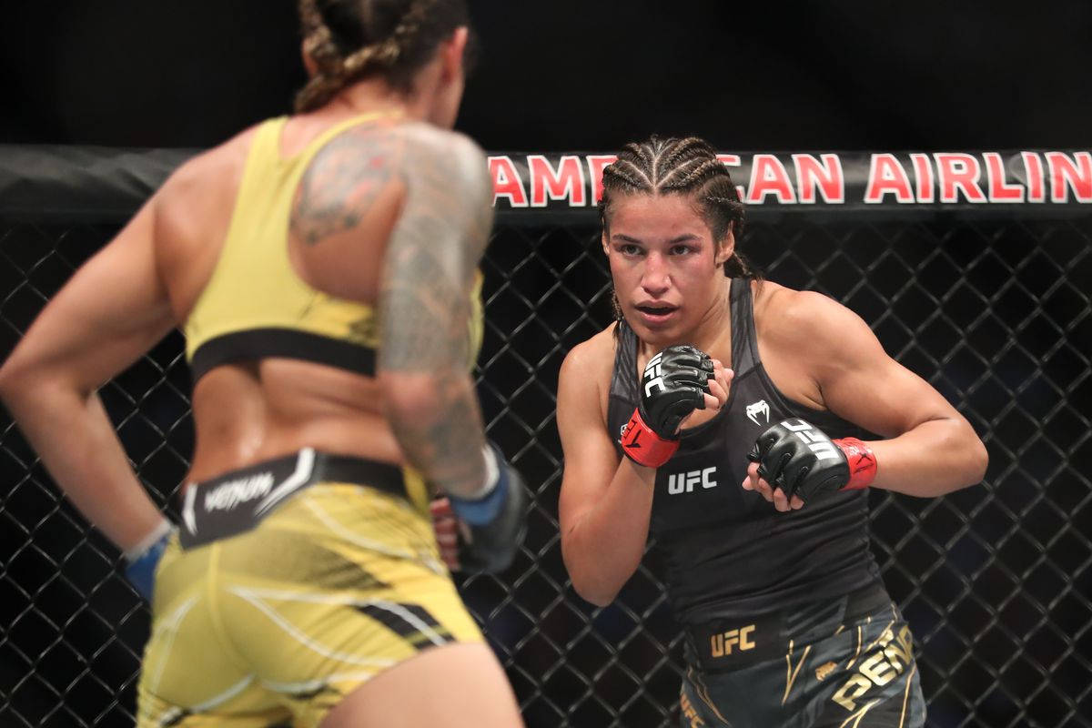 Julianna Peña And Back Of Amanda Nunes