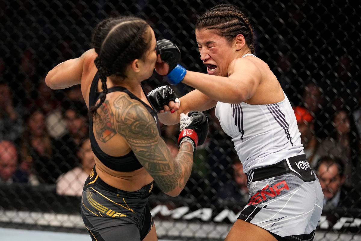 Julianna Peña Punching Face Of Amanda Nunes Background