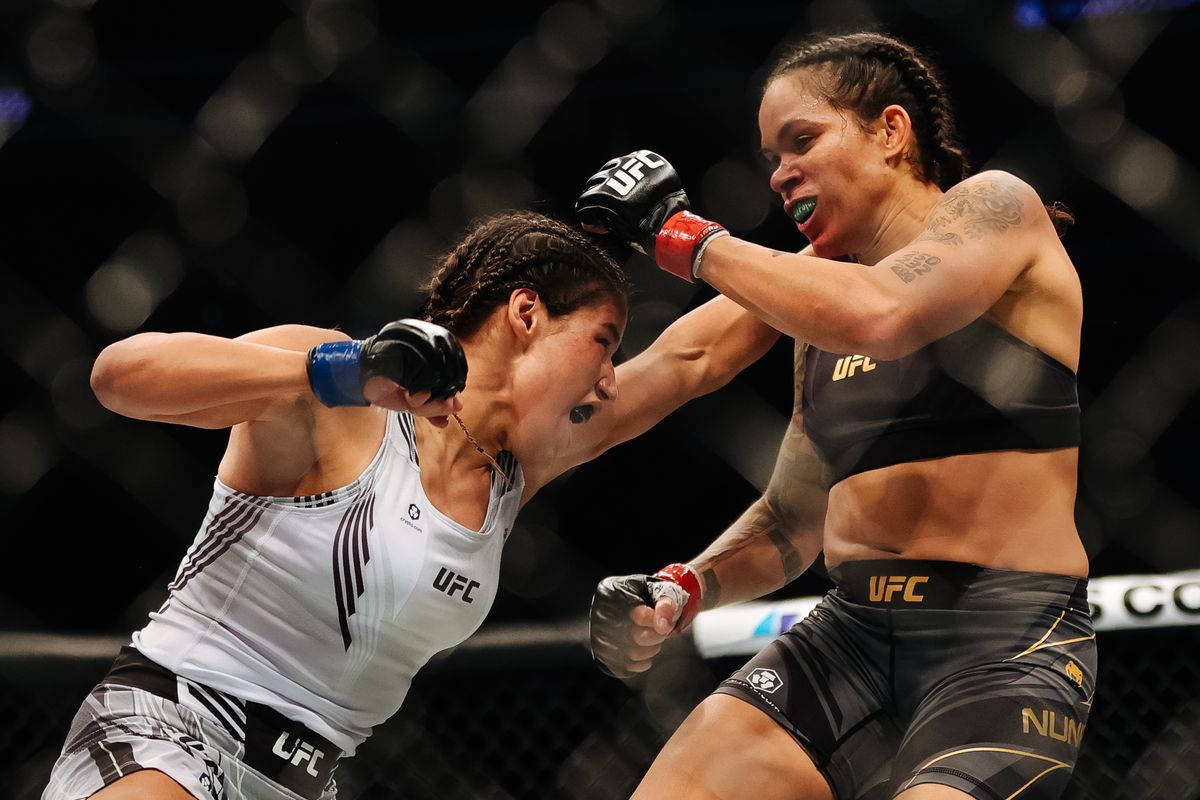 Julianna Peña Toughing It Out Against Amanda Nunes Background