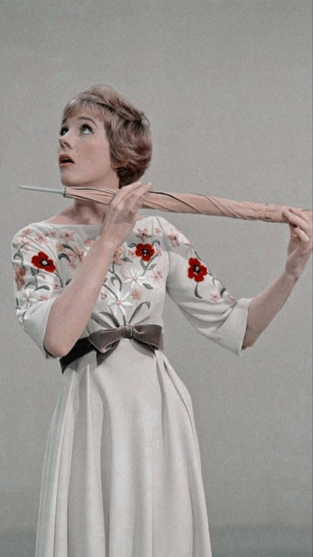 Julie Andrews Holding An Umbrella Background