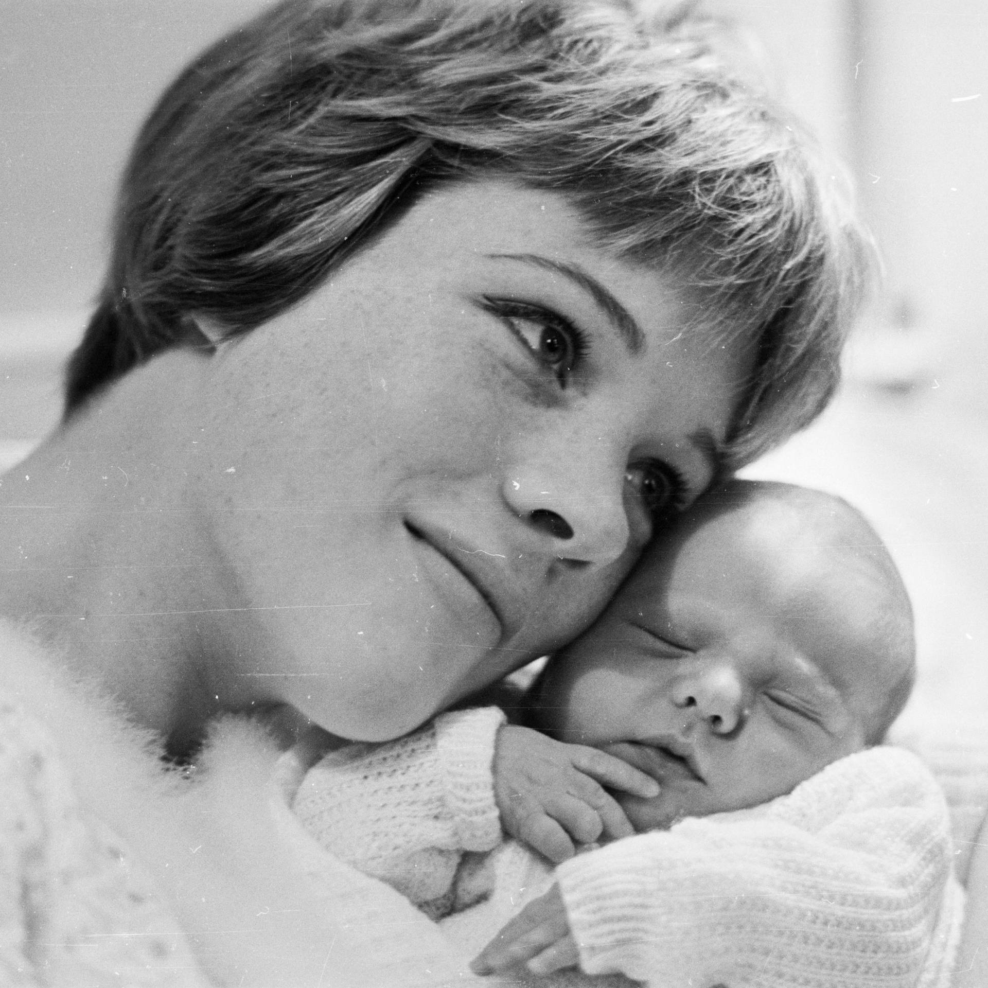 Julie Andrews With A Baby Background