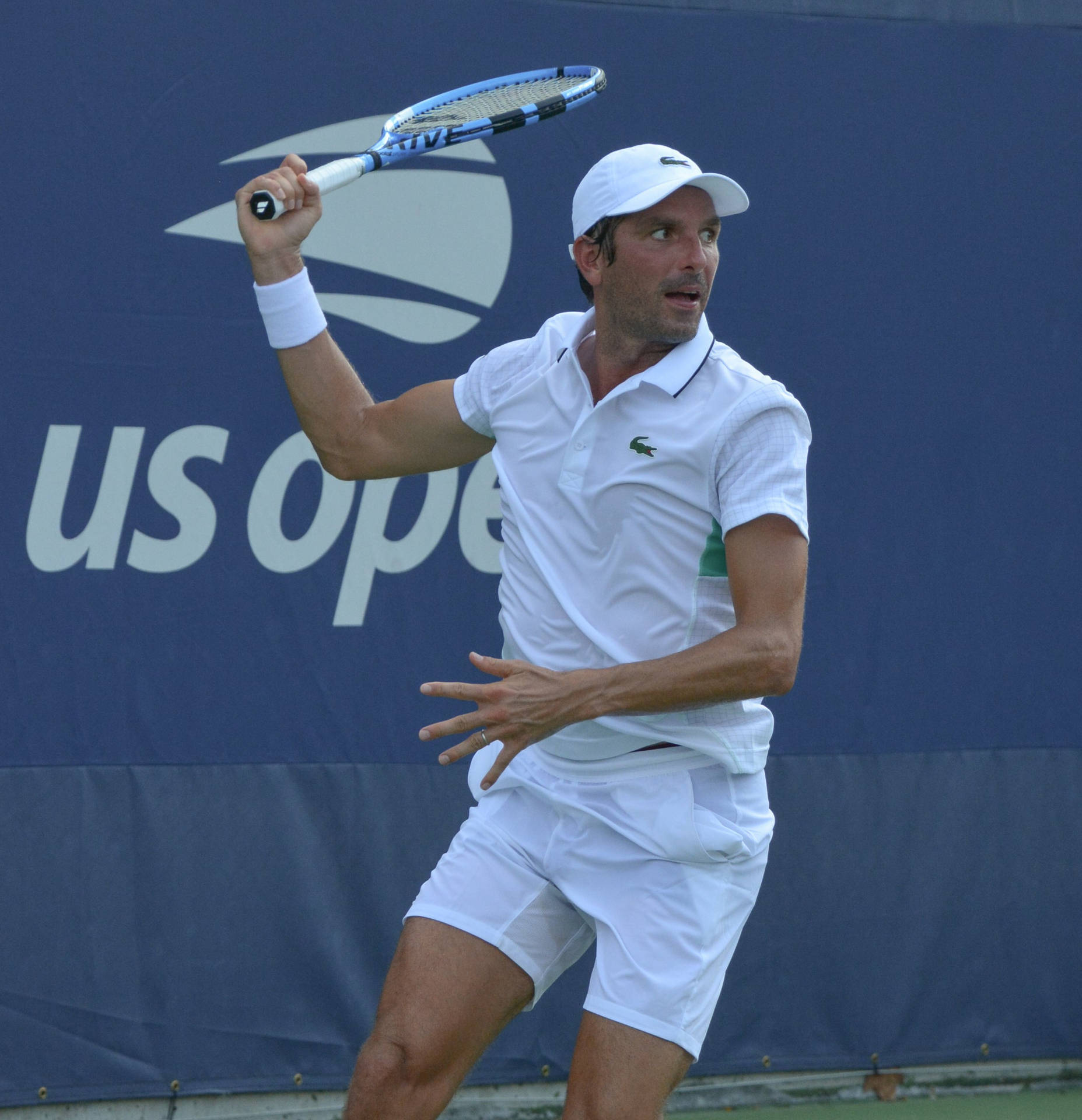 Julien Benneteau Exhibiting Skill On Tennis Court Background