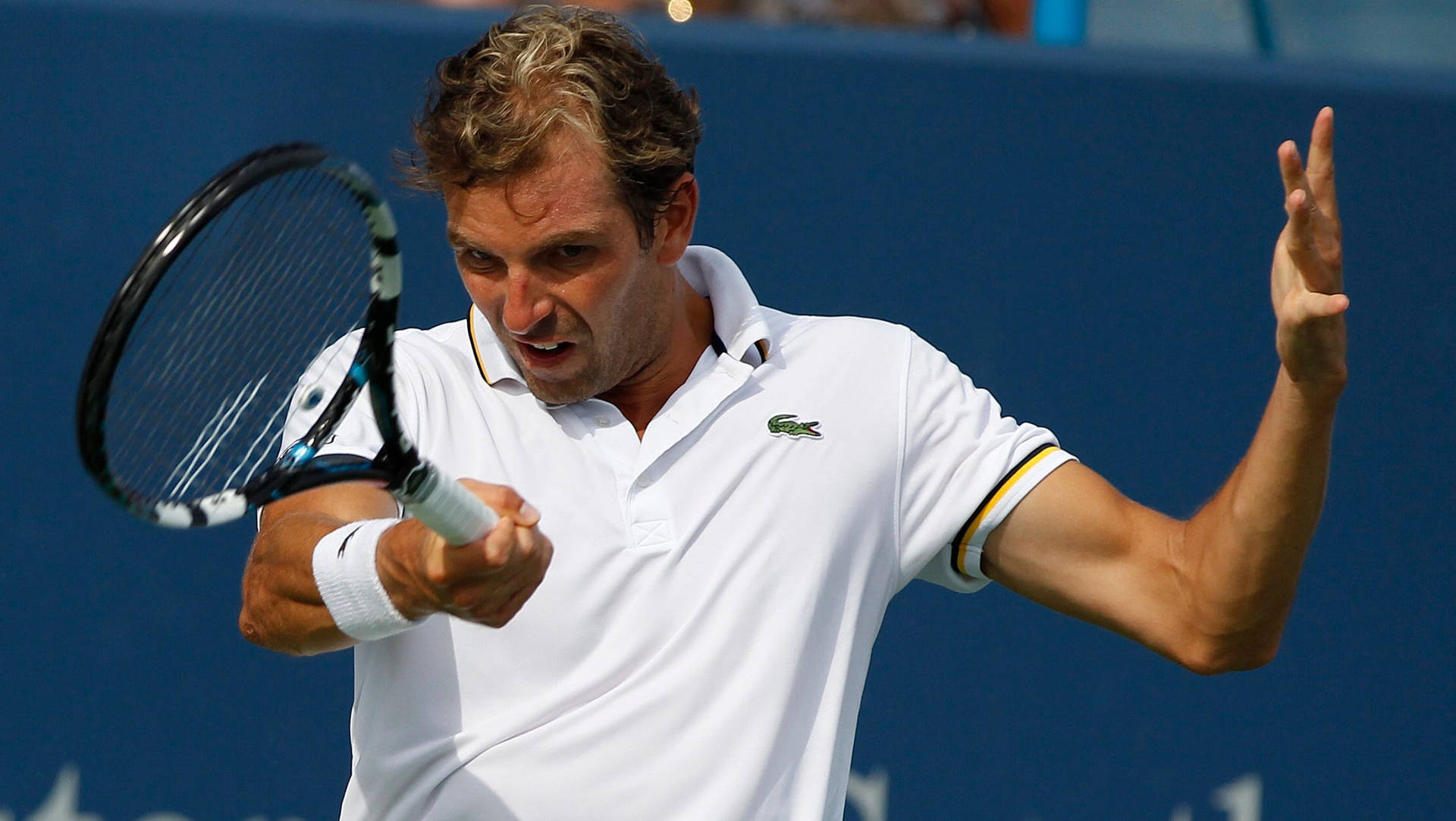 Julien Benneteau Pulling A Comical Expression On Court Background