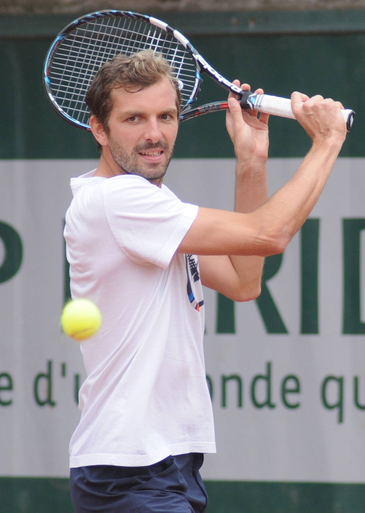 Julien Benneteau With Two-handed Backhand Stroke Background