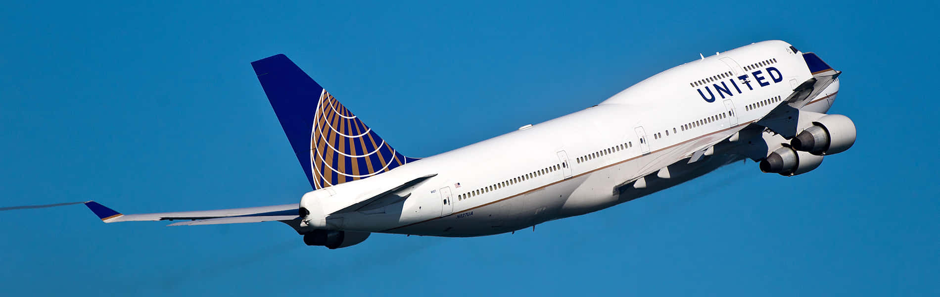 Jumbo Jet Cruising Across The Sky Background