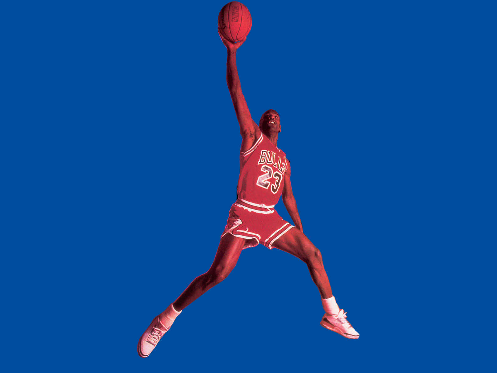 Jump Into Sporty Style In Red Jordan Shoes Background