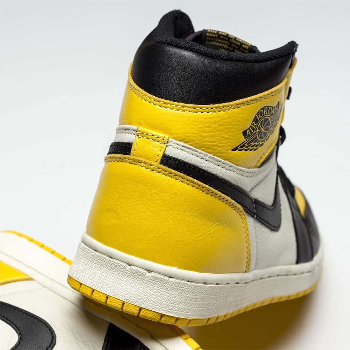 Jump Into Style With This Signature Yellow Jordan Footwear! Background