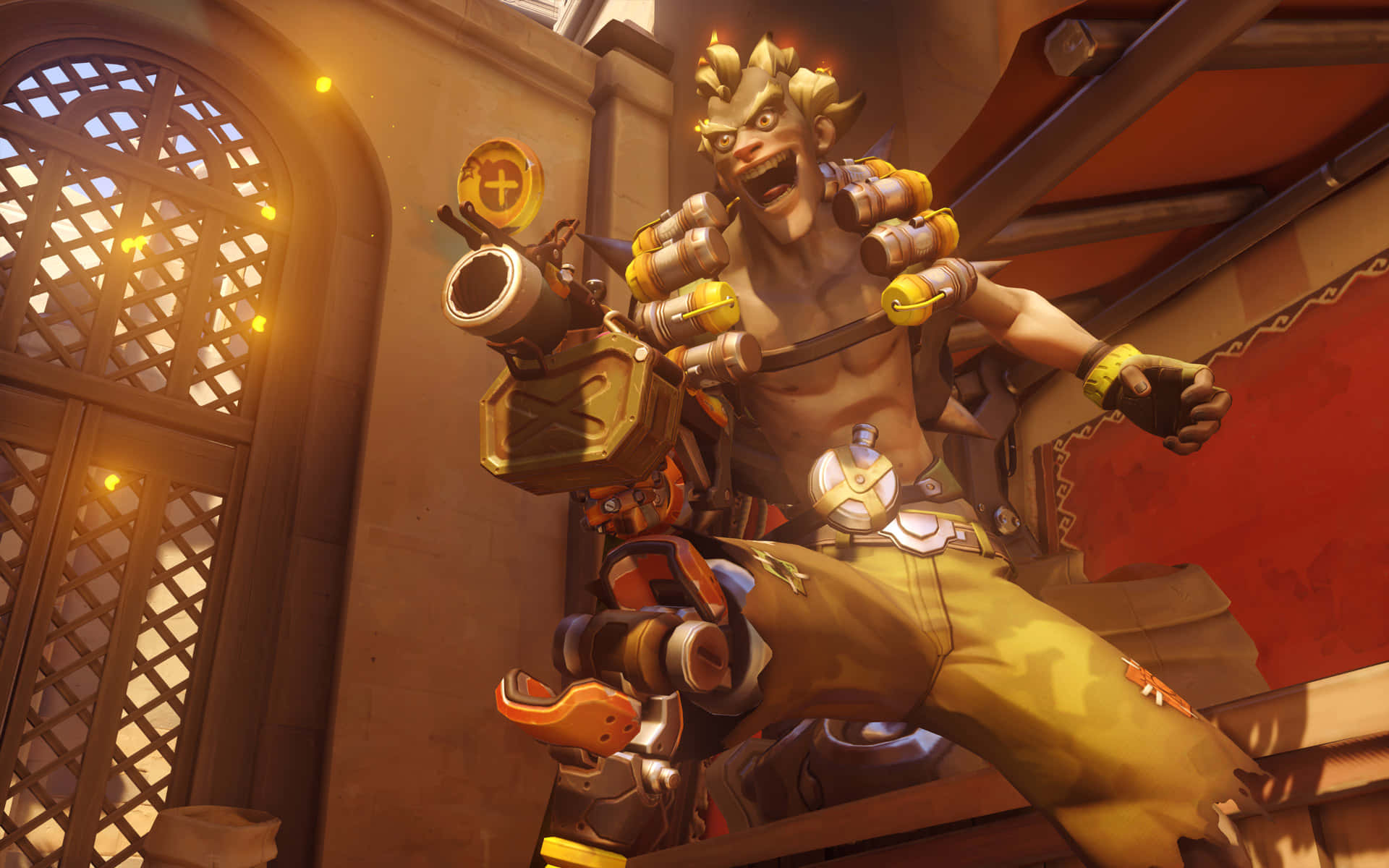 Junkrat Sits Atop A Crumbling Structure With A Mischievous Smirk Background