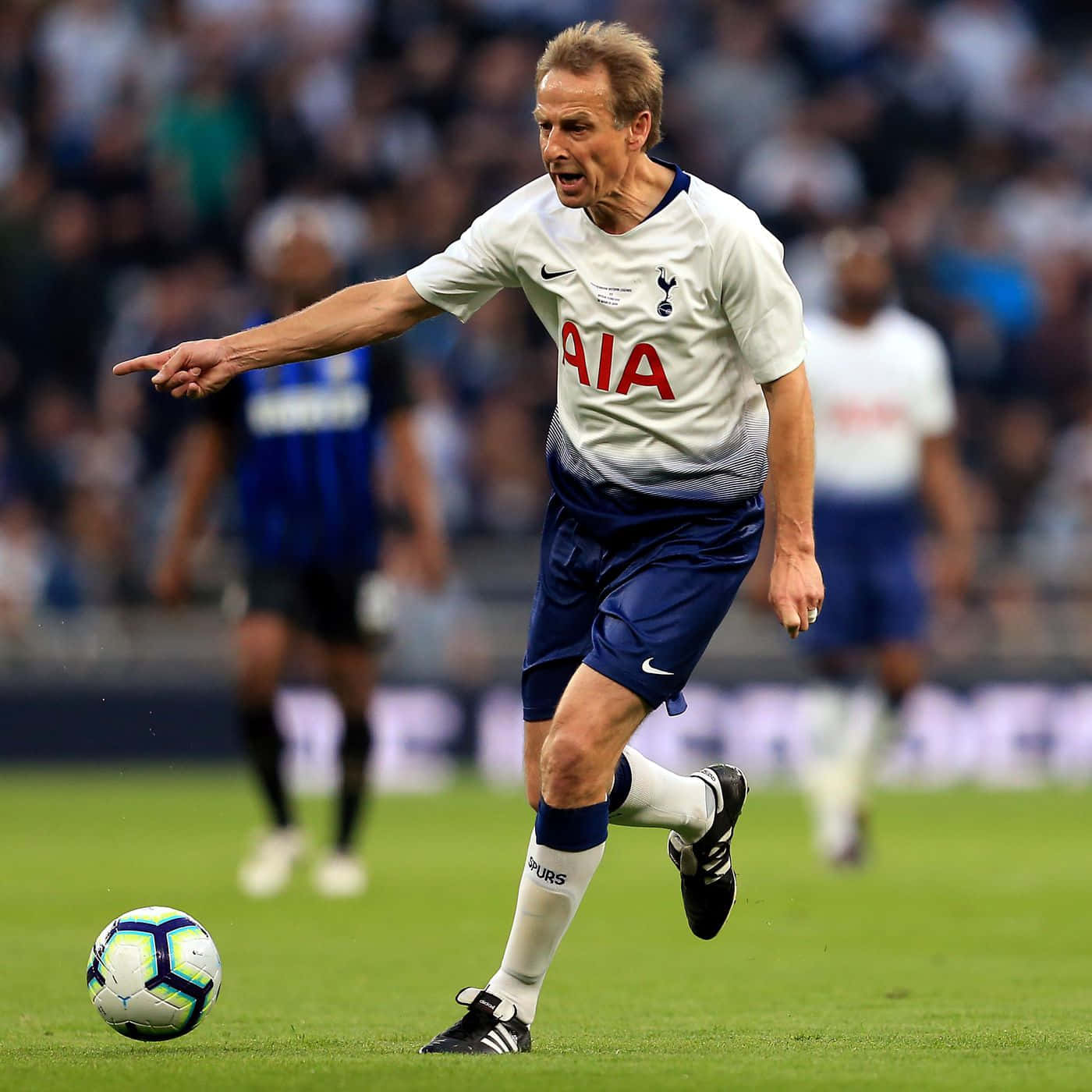 Jurgen Klinsmann Kicking Ball Background