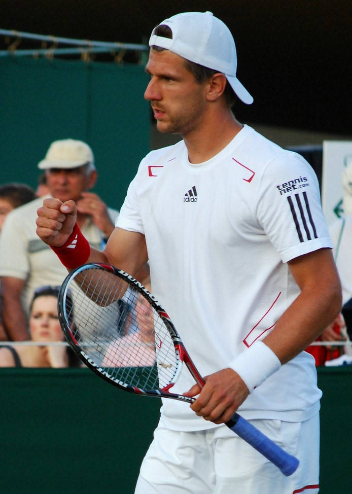 Jurgen Melzer Fist Pump While Holding Racket Background