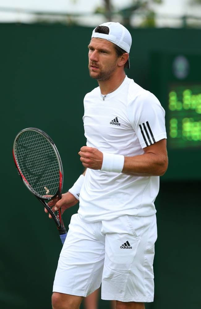 Jurgen Melzer In All-white Outfit Background