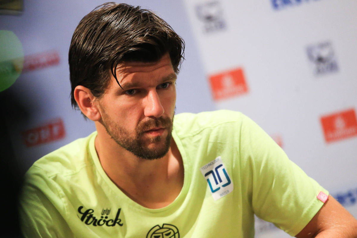 Jurgen Melzer Wearing Yellow At Conference Background