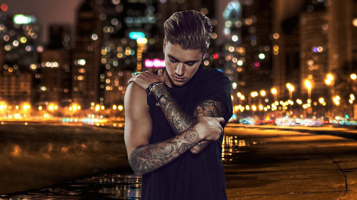 Justin Bieber At Night In A City Background