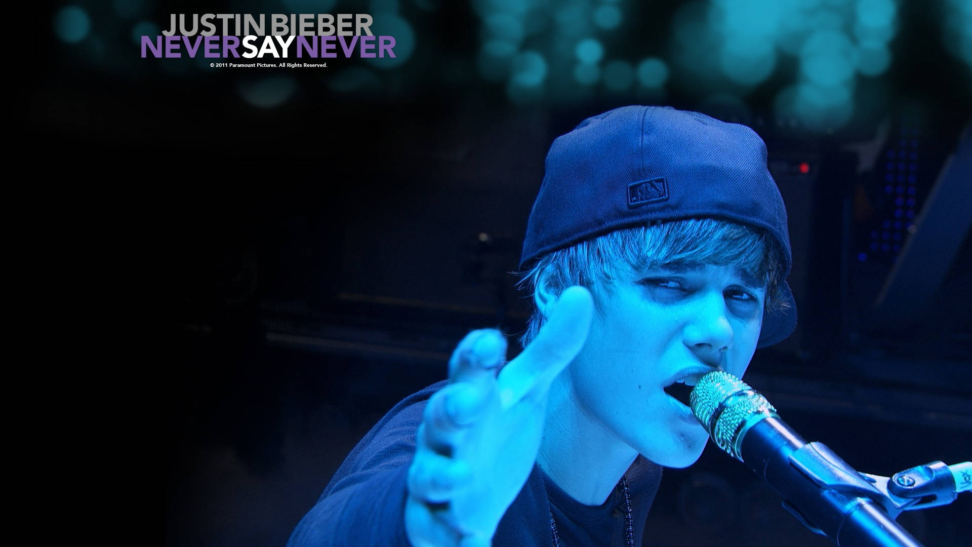 Justin Bieber Performing On Stage Background