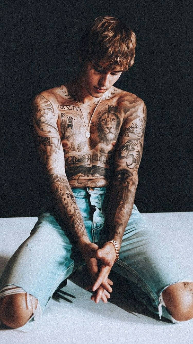Justin Bieber Shows Off His Many Tattoos Background