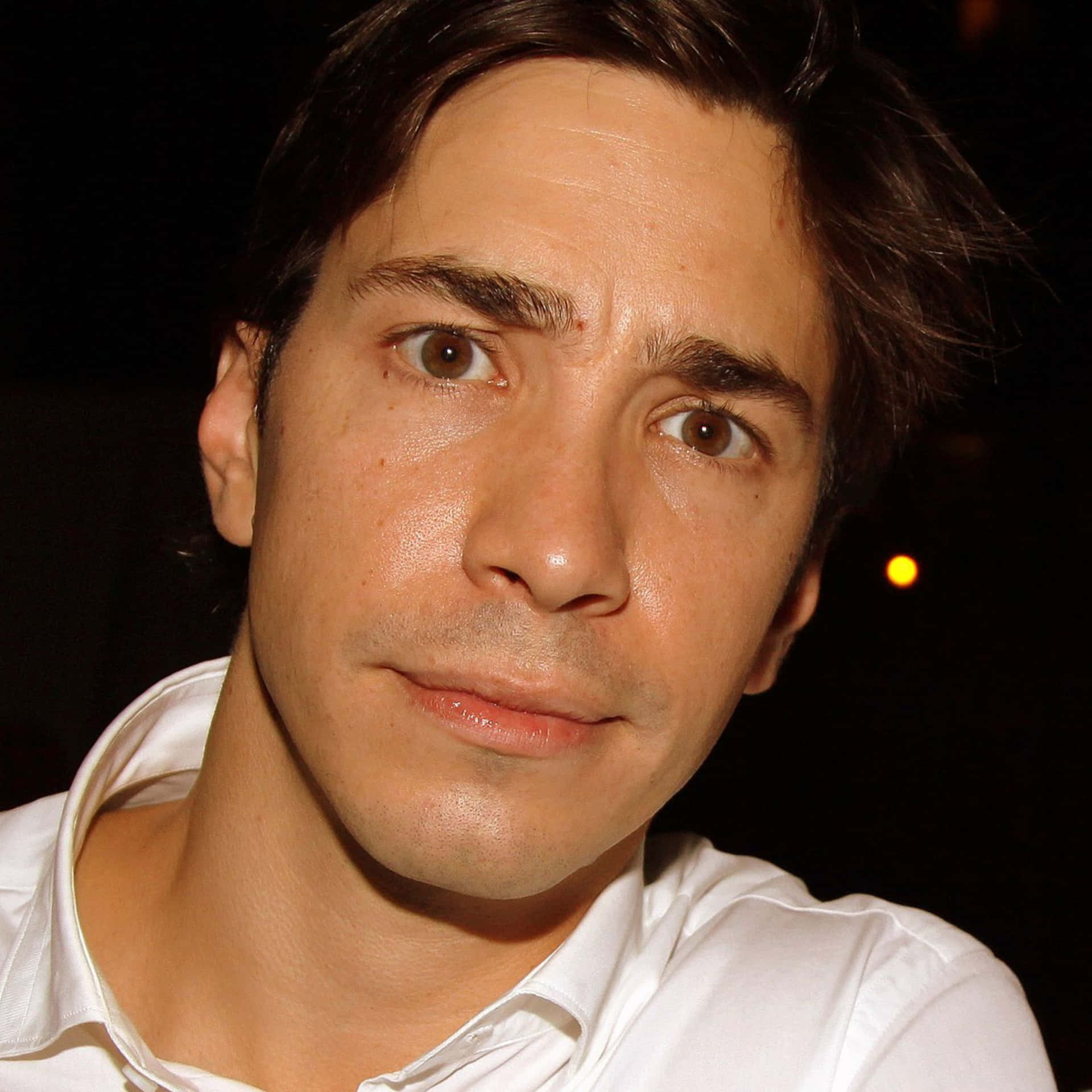 Justin Long Smiling For A Portrait