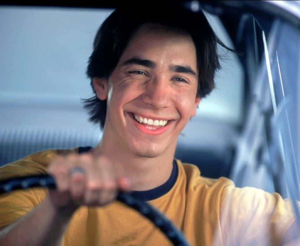Justin Long Striking A Casual Pose On An Urban Streetscape