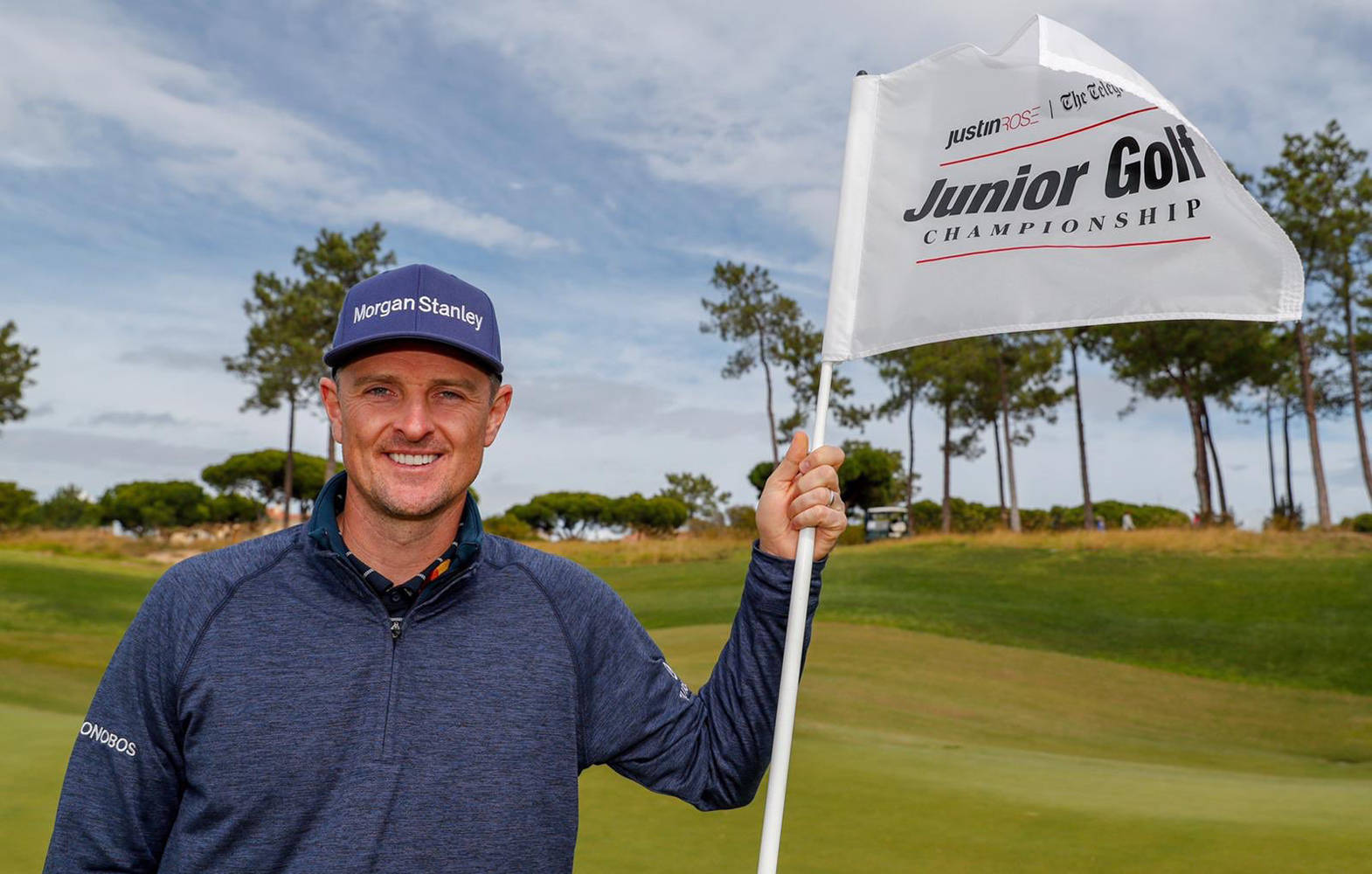 Justin Rose Holding A White Flag