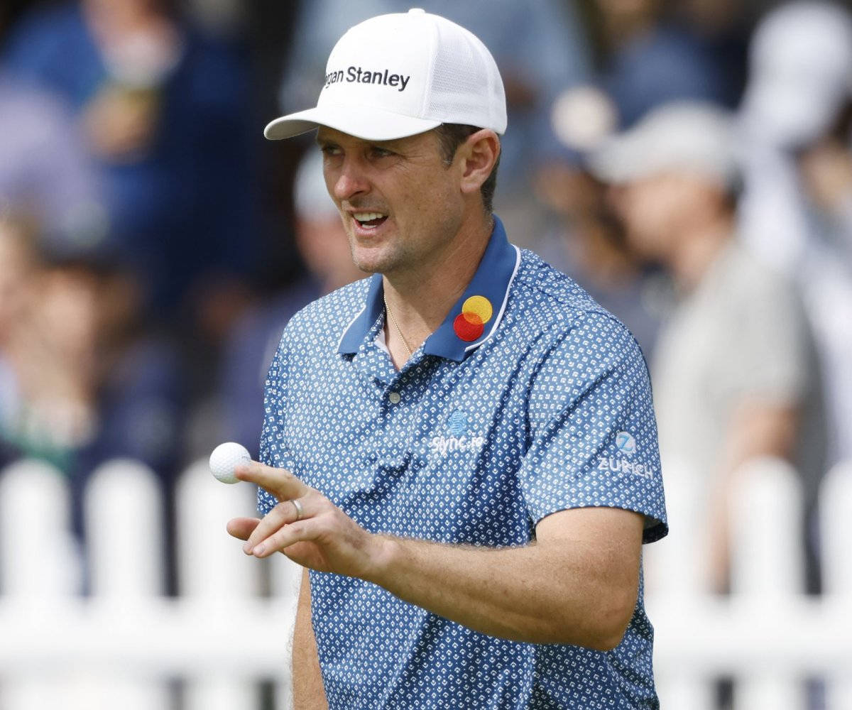 Justin Rose Holding Golf Ball Background