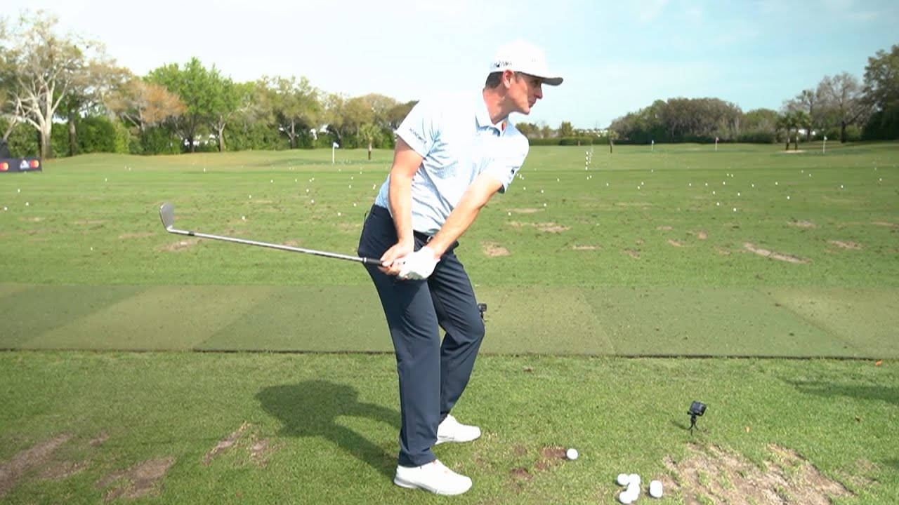 Justin Rose Holding Golf Club