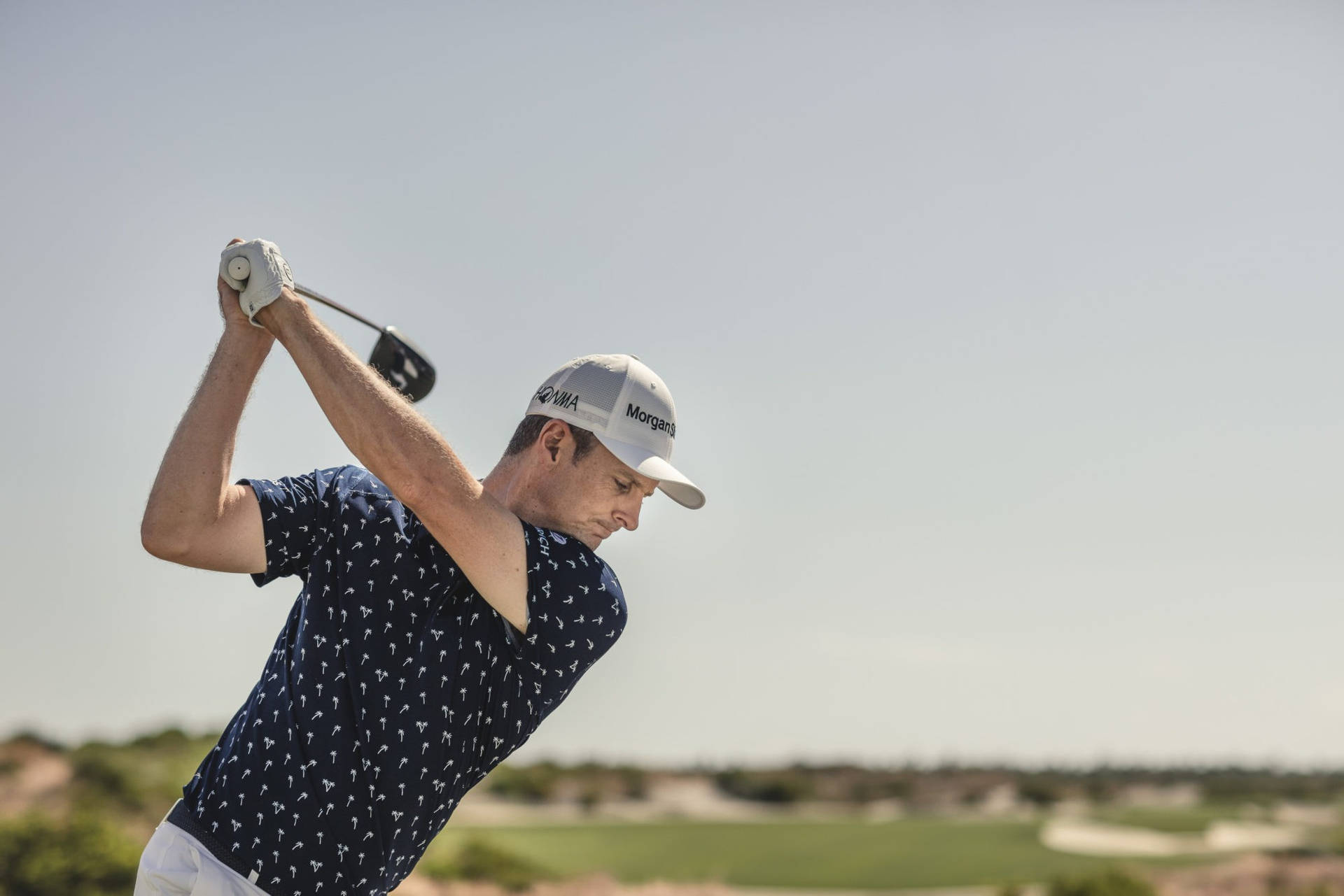 Justin Rose Swinging Golf Club Background