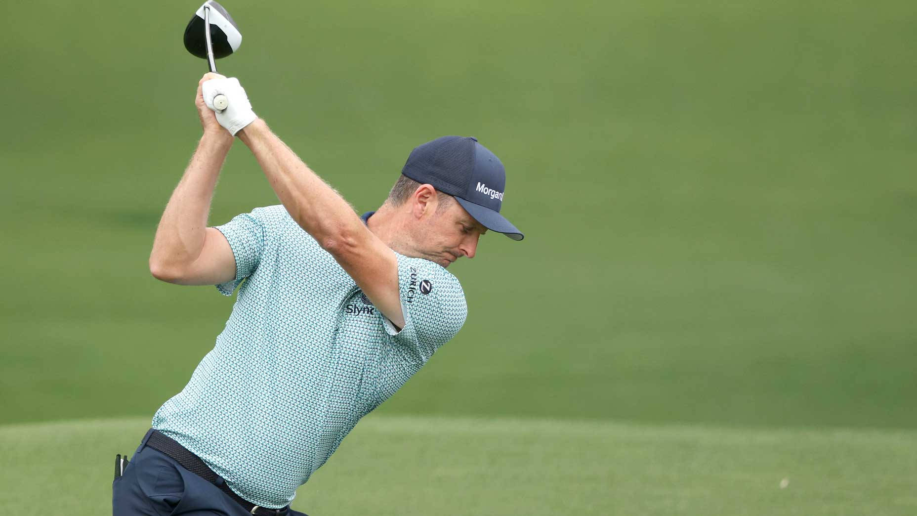 Justin Rose Winding Up For A Swing Background