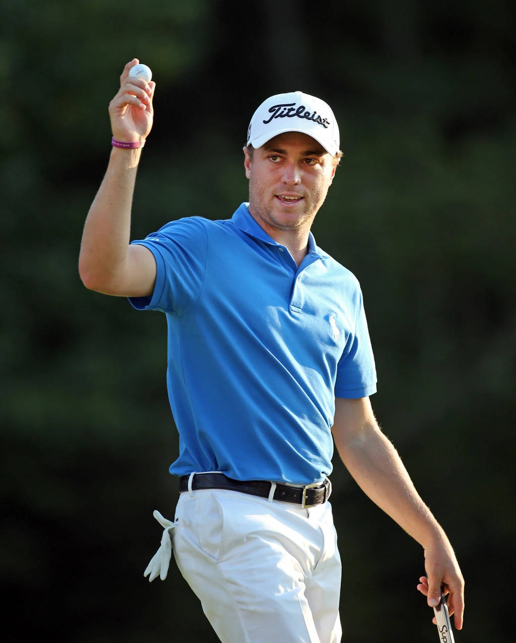 Justin Thomas With A Golf Ball Background