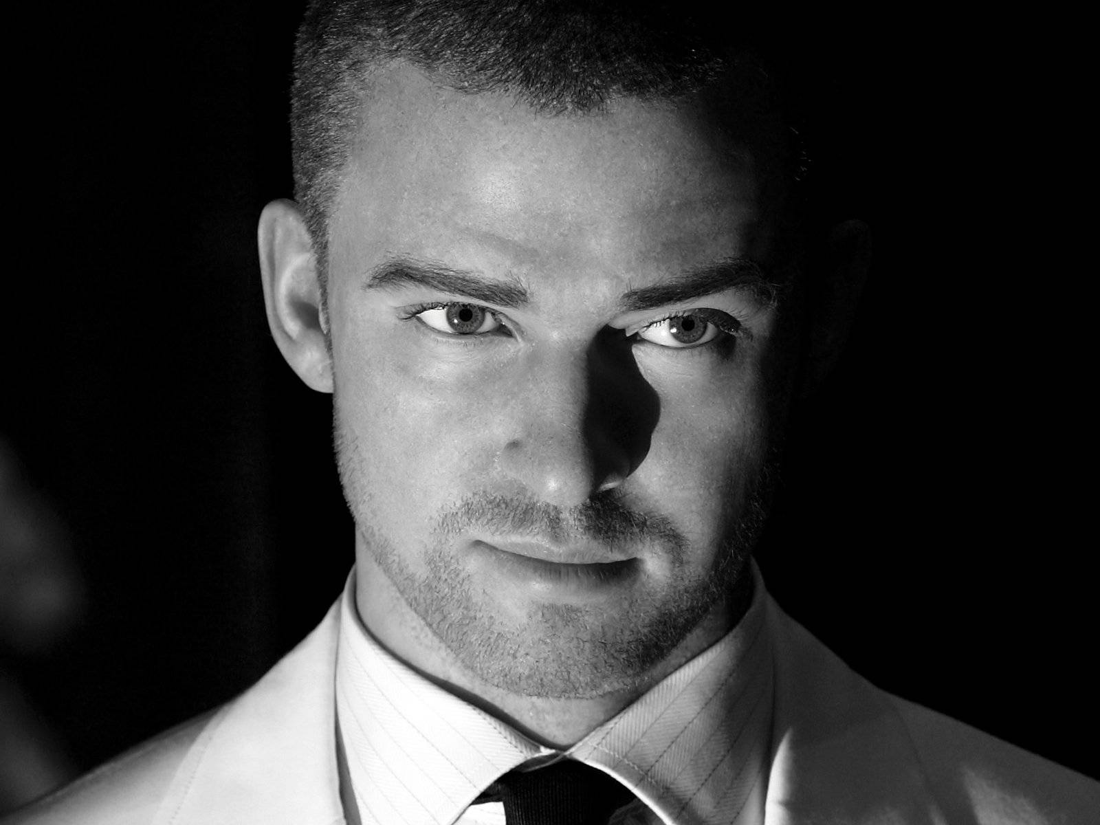 Justin Timberlake Black And White Smirking Background